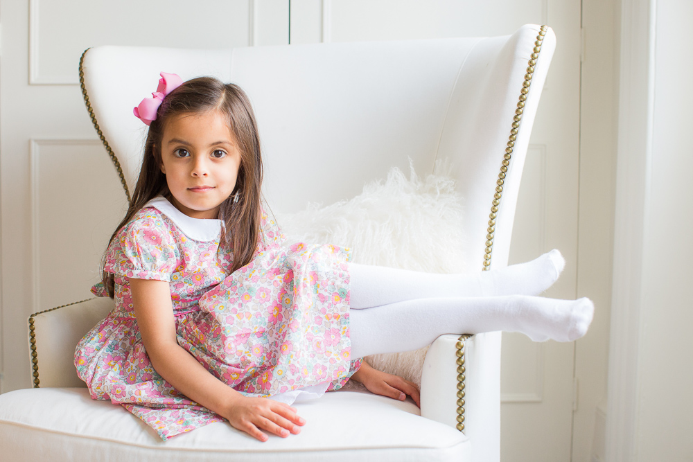 London family photos - portrait of a little girl dressed in pink on their family photoshoot day