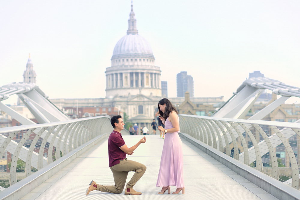Marriage proposal captured by engagement photographer on Millenium Bridge in London