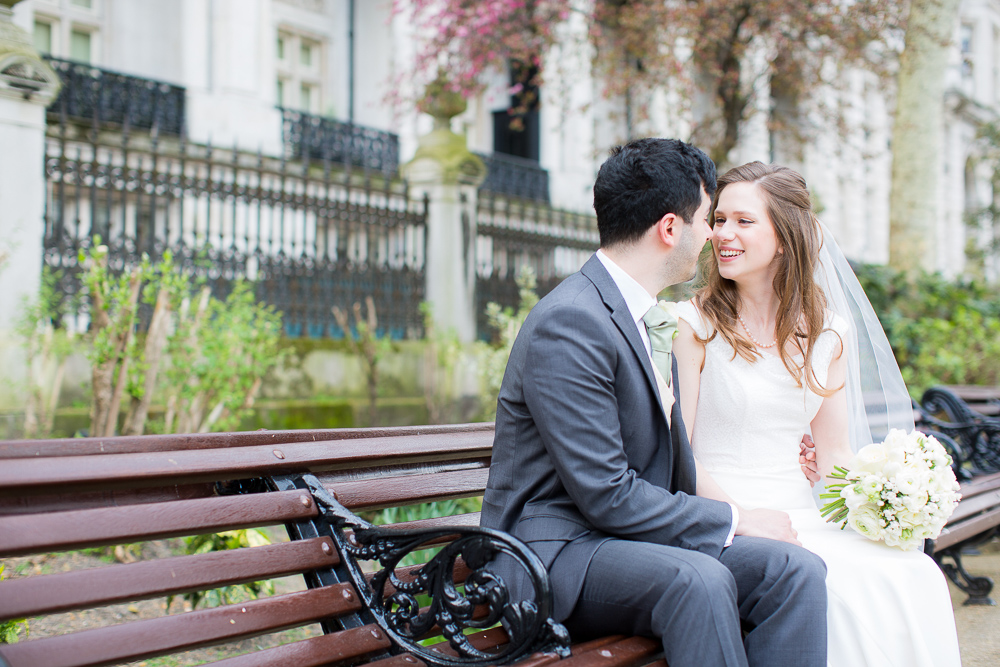 Bride and groom posing for professional elopement photos in London