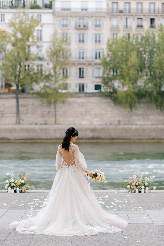 Bride posing during her elopement by the river