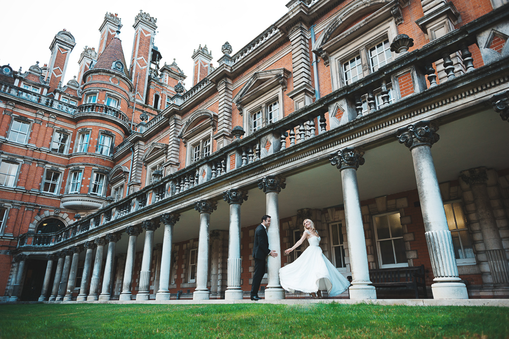 London Elopement - Couple dancing in front of Royal Holloway in London