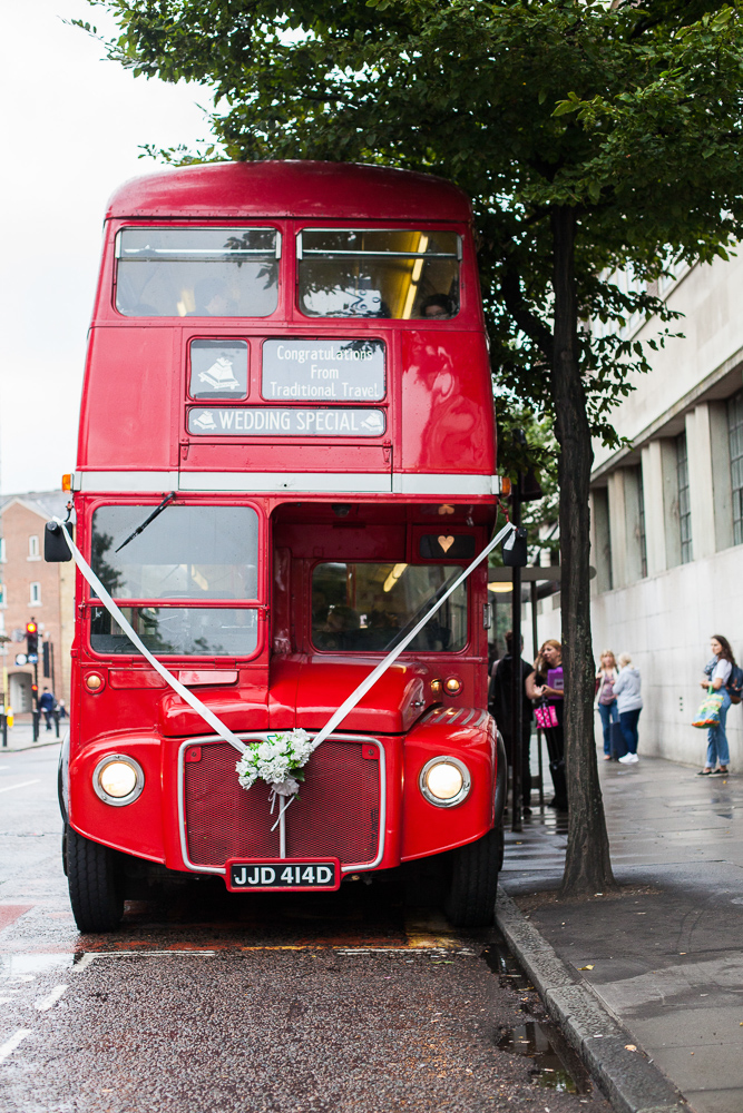 Red buss decorated for a wedding in London