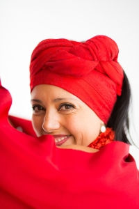 Headshot of a woman wearing red outfit