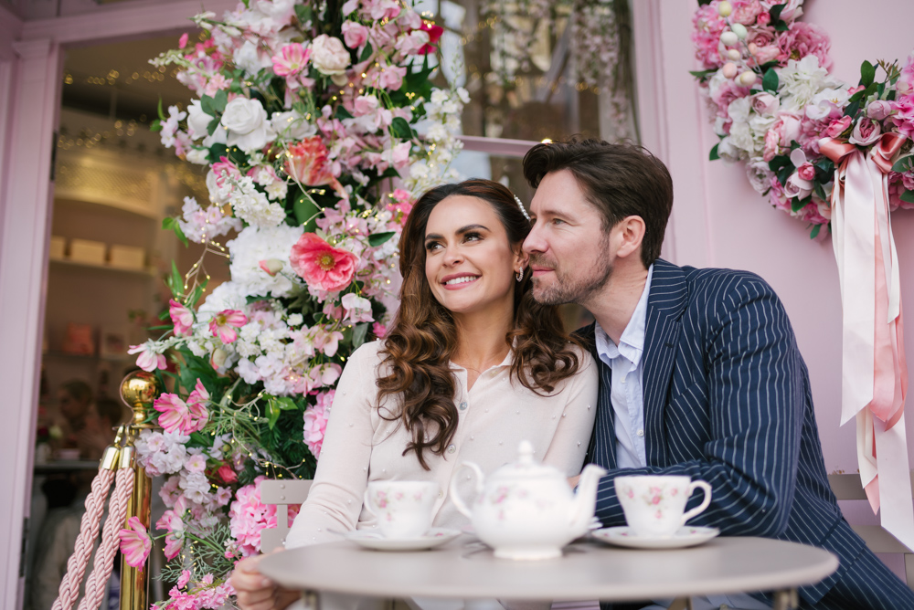 Beautiful couple having tea at Peggy Porschen in Chelsea London