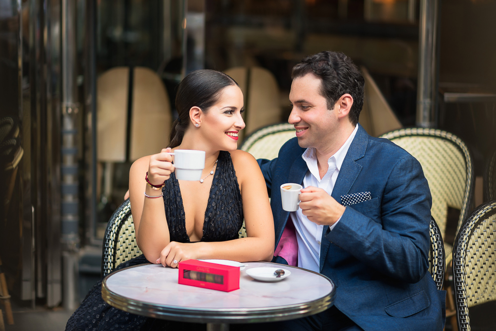 Newly engaged couple enjoying engagement with cappuccino