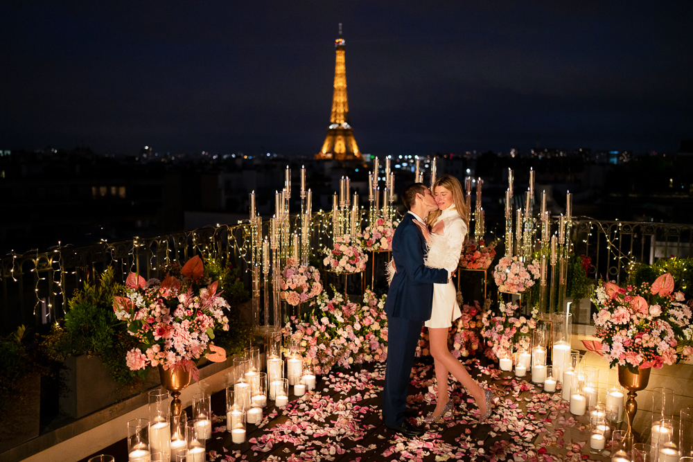 Private rooftop proposal with flowers and candles