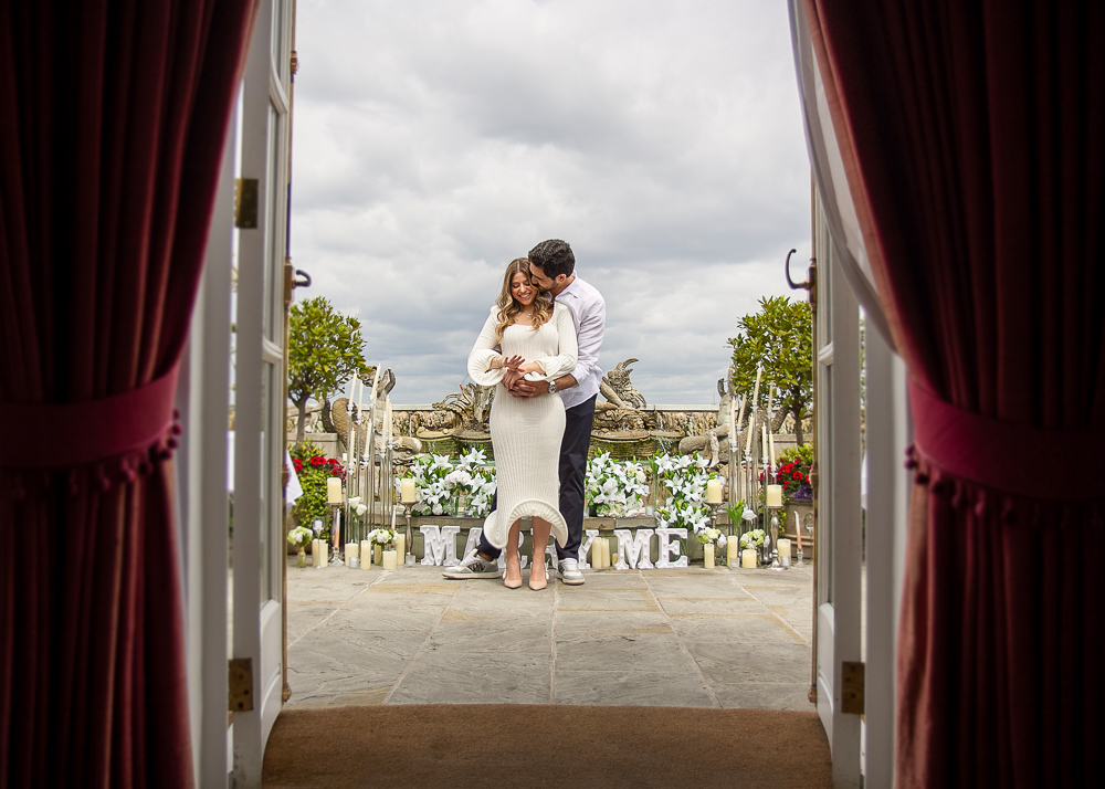 Newly engaged couple posing for engagement photos after a restaurant proposal in London