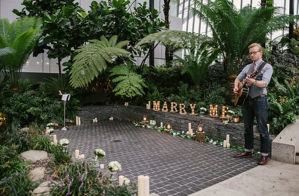 Marry me letters with a professional musician on the side at the Sky Garden