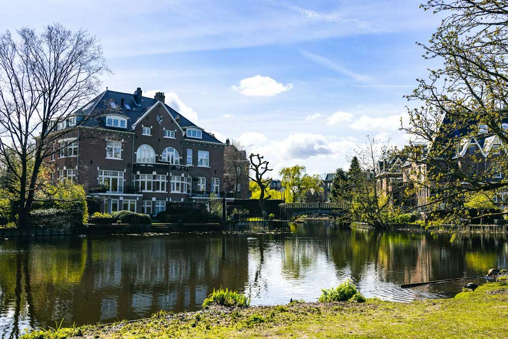 Where to Propose in Amsterdam - Vondelpark image with a lake and a small bridge