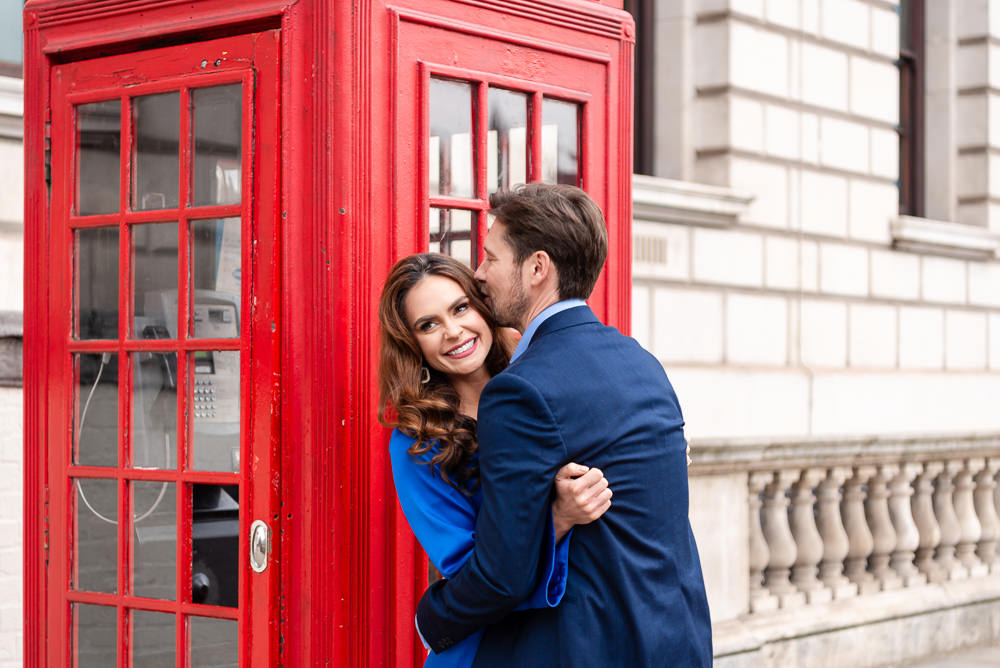 Engagement couple photoshoot london - red telephone boot romantic picture